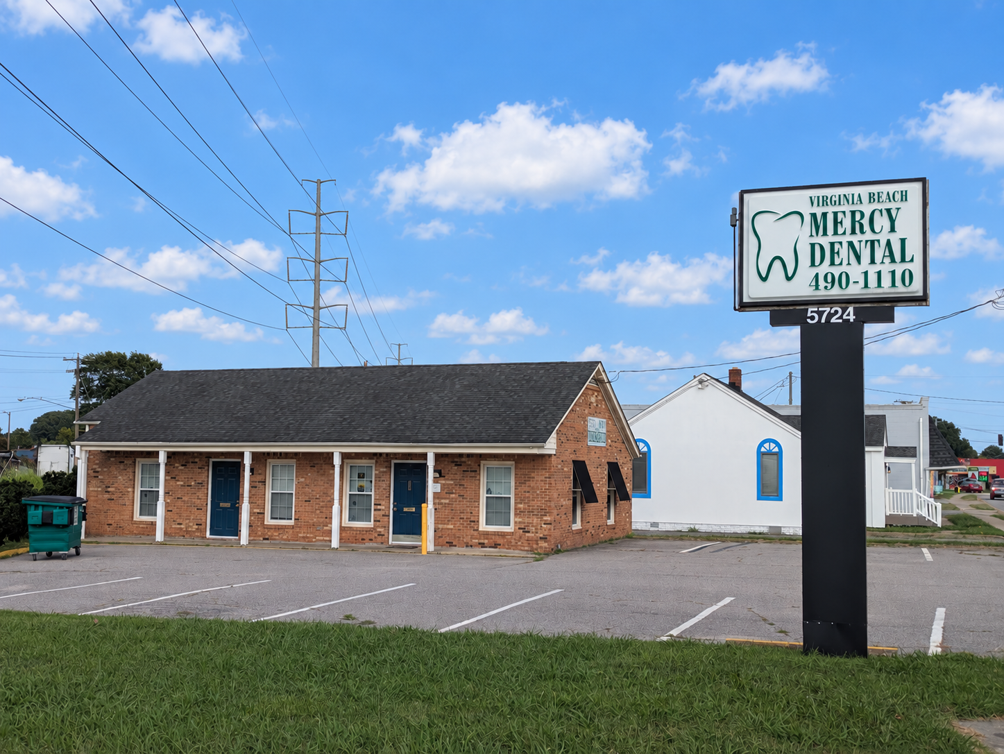 Dental Office outside view with the sign that says Virginia Beach Mercy Dental 490-110 and address number 5724